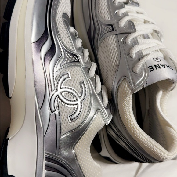 CHANEL Women's Metallic Silver and White Sneakers - Picture 1 of 4